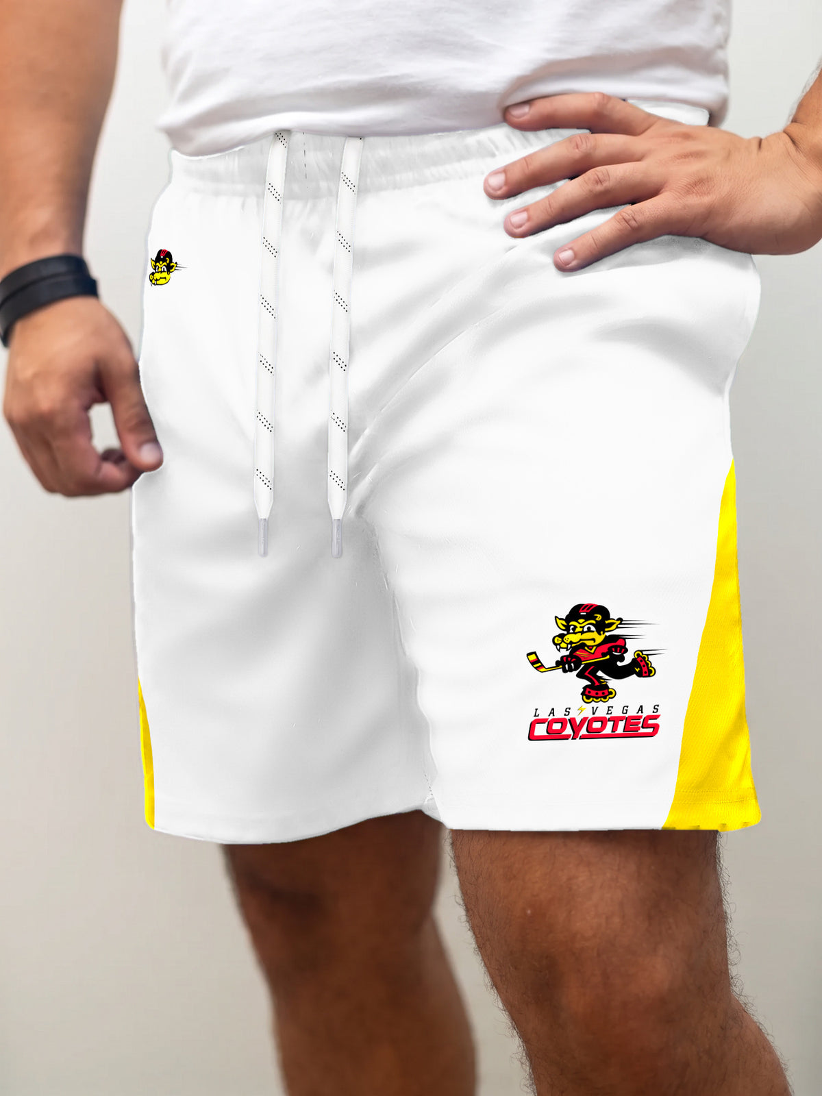 Model wearing the Bench Clearers Las Vegas Coyotes Away Hockey Shorts - front view